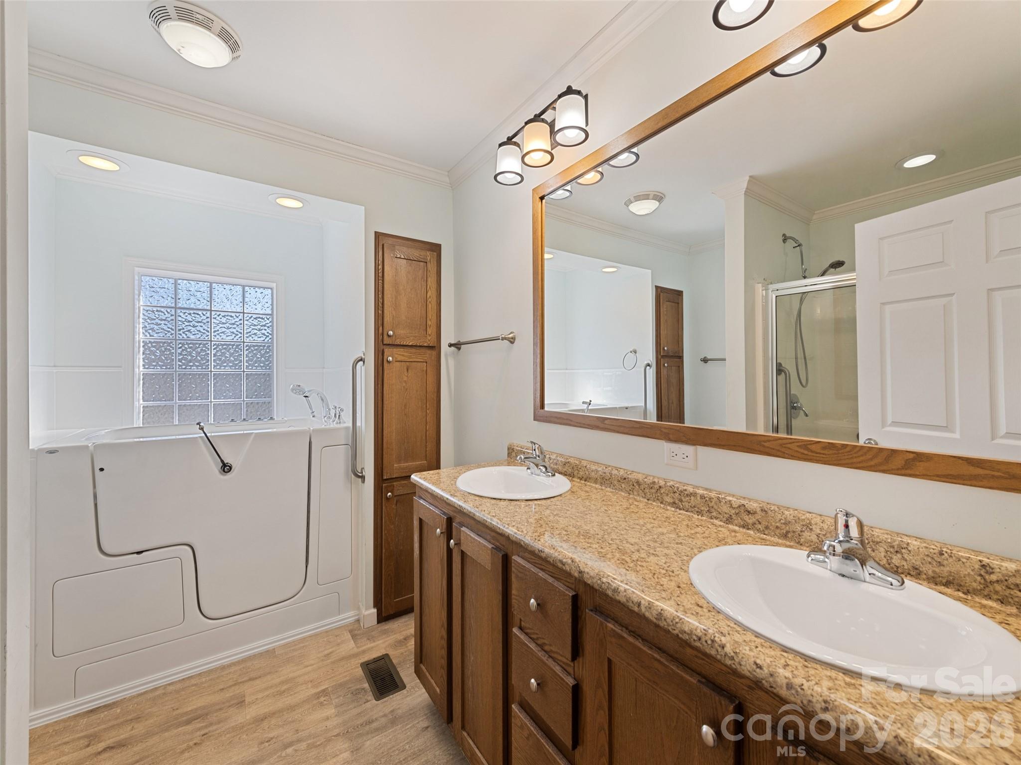 10 Enochs Way Fletcher, NC 28732 - Photo 14 of 24 a bathroom with a granite countertop sink mirror and a shower