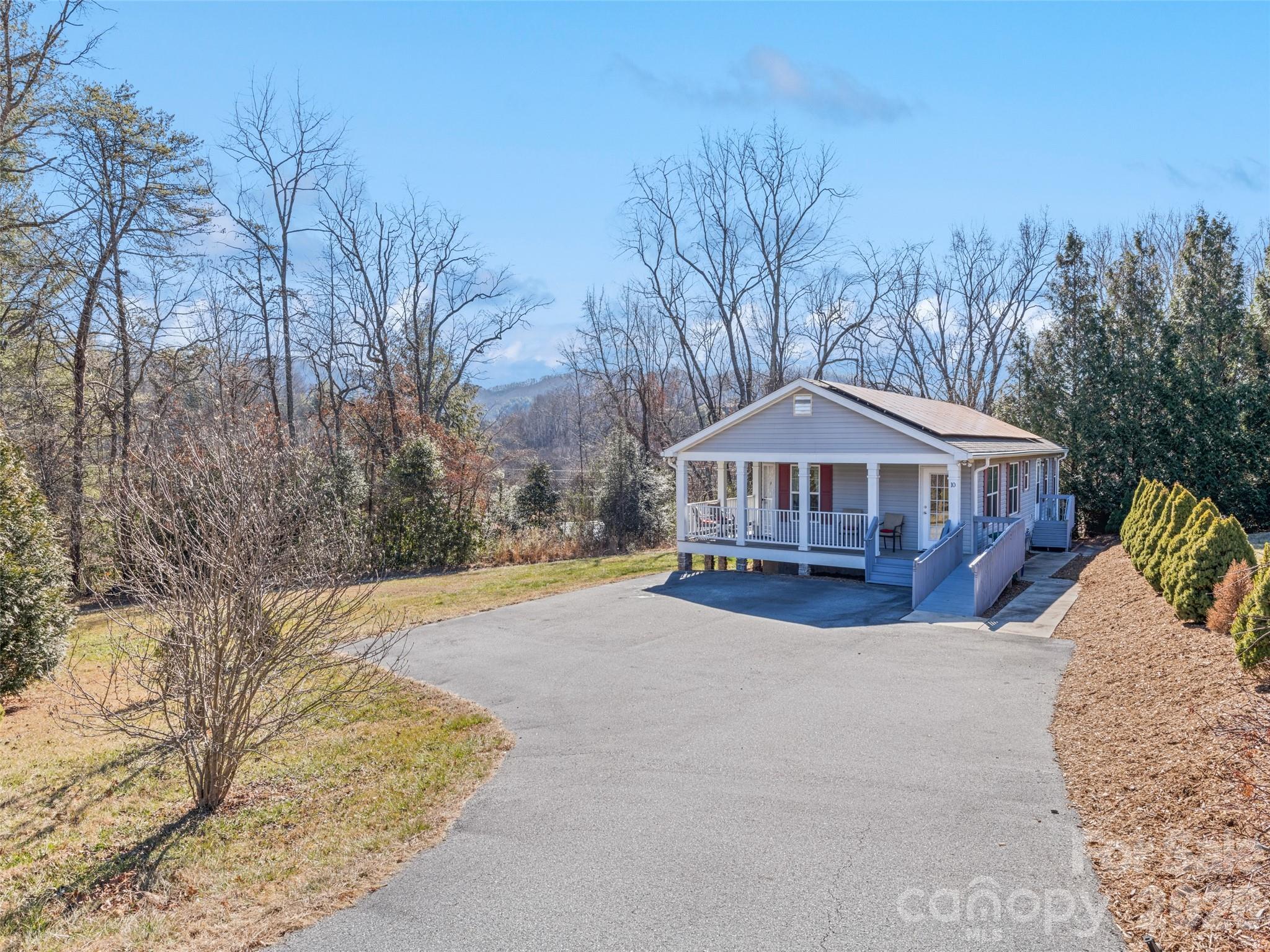 10 Enochs Way Fletcher, NC 28732 - Photo 23 of 24 a view of house with yard and trees in the background