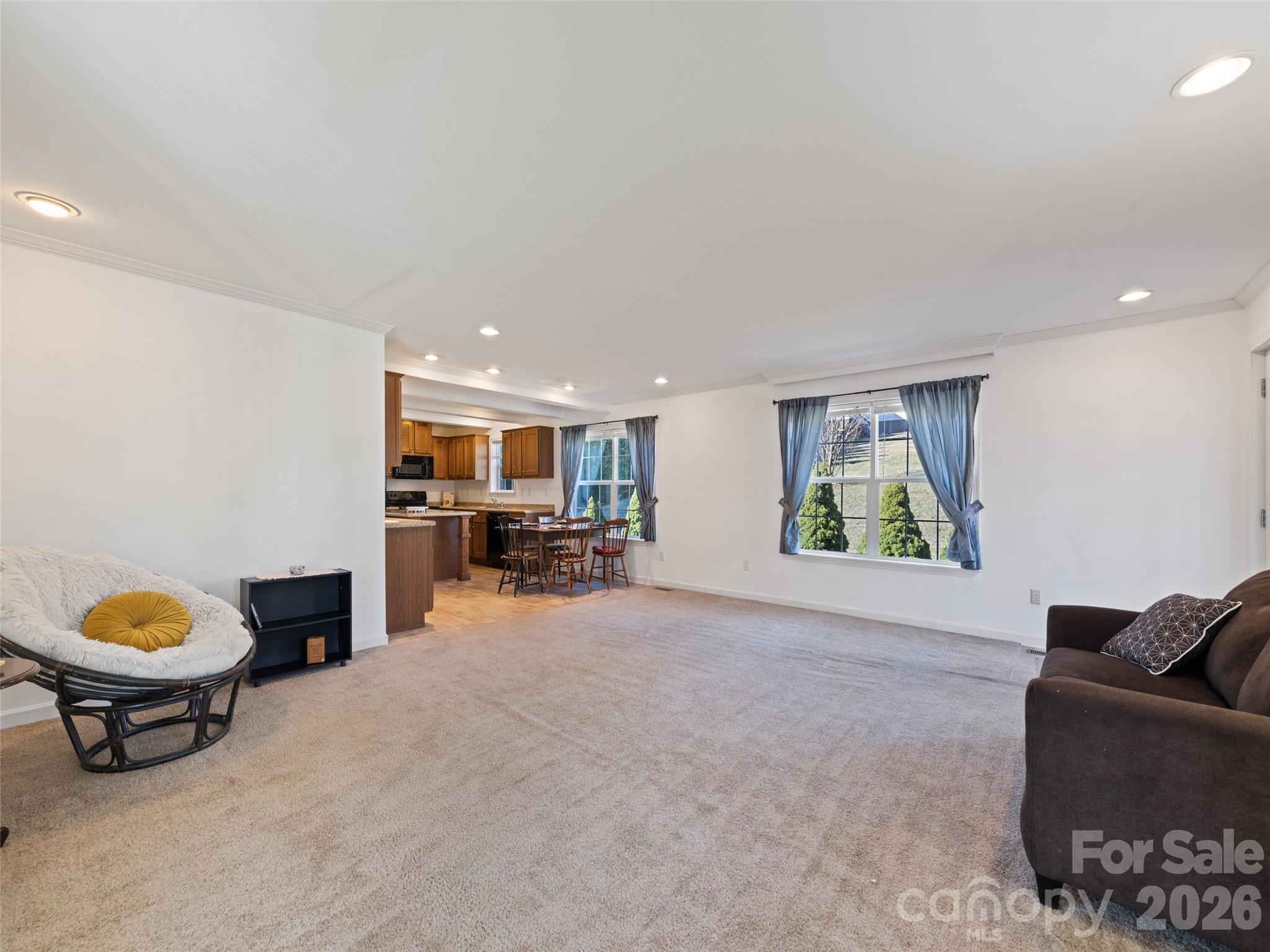 10 Enochs Way Fletcher, NC 28732 - Photo 8 of 24 a living room with furniture and a window