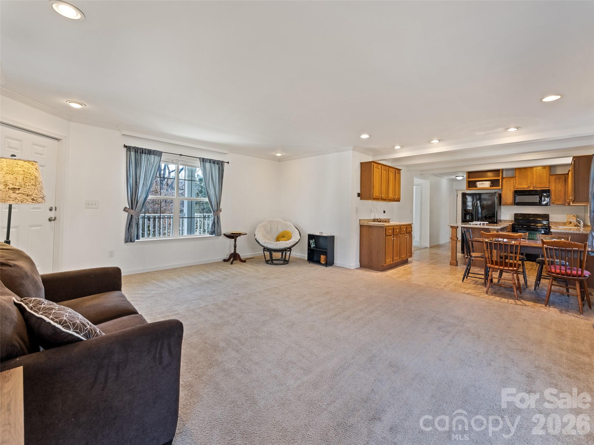 10 Enochs Way Fletcher, NC 28732 - Photo 9 of 24 a living room with furniture and a flat screen tv