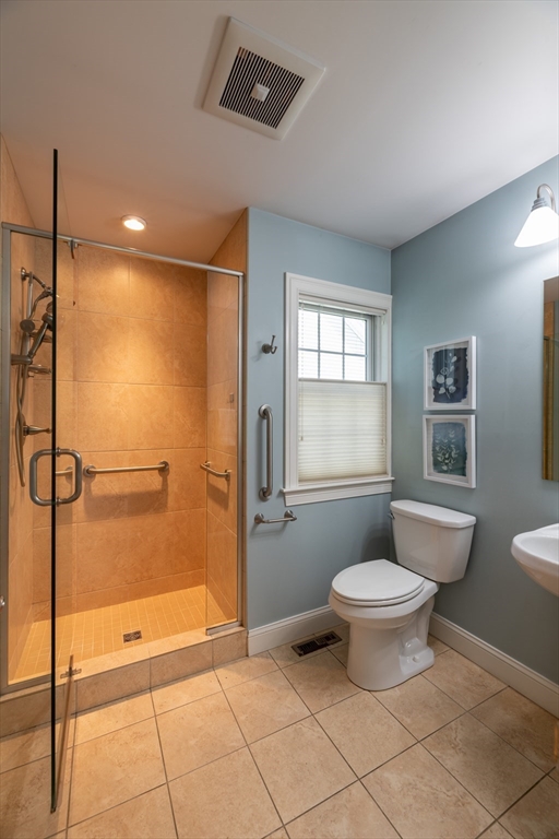20 Bridge Road, Unit 8 Northampton, MA 01062 - Photo 17 of 32 a bathroom with a granite countertop sink a toilet and shower