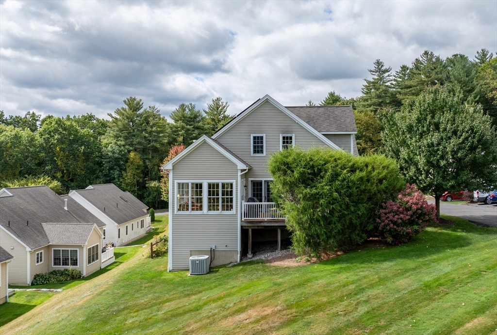 20 Bridge Road, Unit 8 Northampton, MA 01062 - Photo 3 of 32 a aerial view of a house with a yard and plants