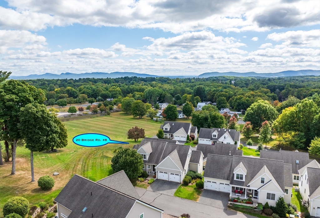 20 Bridge Road, Unit 8 Northampton, MA 01062 - Photo 4 of 32 an aerial view of a house with a garden