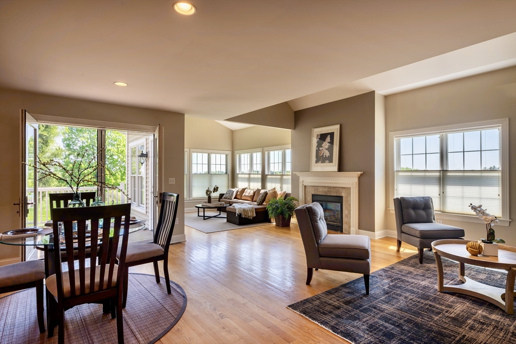 20 Bridge Road, Unit 8 Northampton, MA 01062 - Photo 5 of 32 a living room with fireplace furniture and a large window