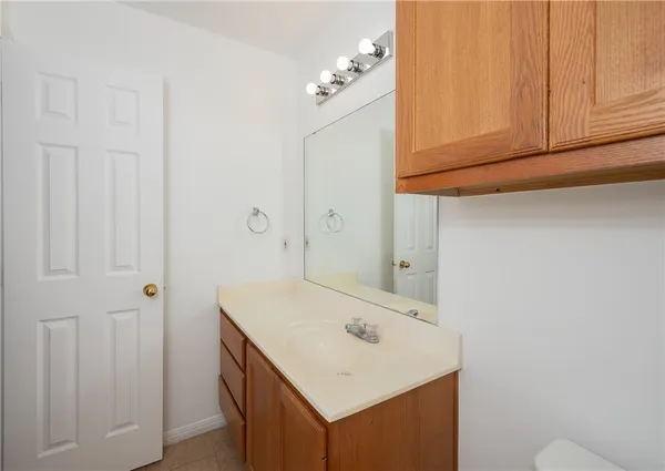 a bathroom with a shower a toilet and a sink