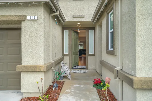 a bathroom with a glass door shower and a sink