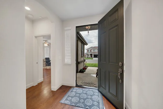 a view of a livingroom with furniture and a flat screen tv