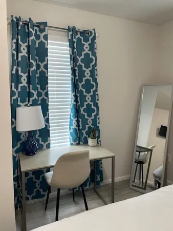 a workspace with furniture and a lamp