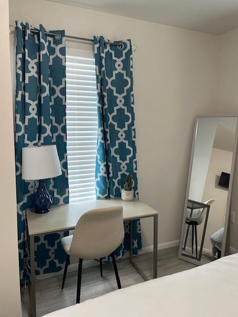 4903 Noble Street, Unit 1 Houston, TX 77020 - Photo 13 of 16 a workspace with furniture and a lamp