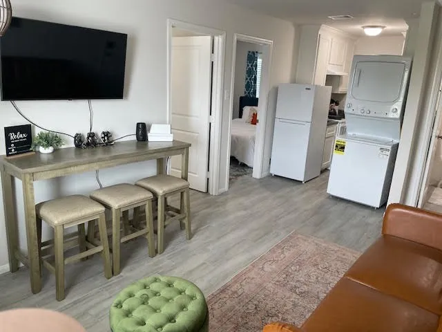 a living room with furniture and a flat screen tv