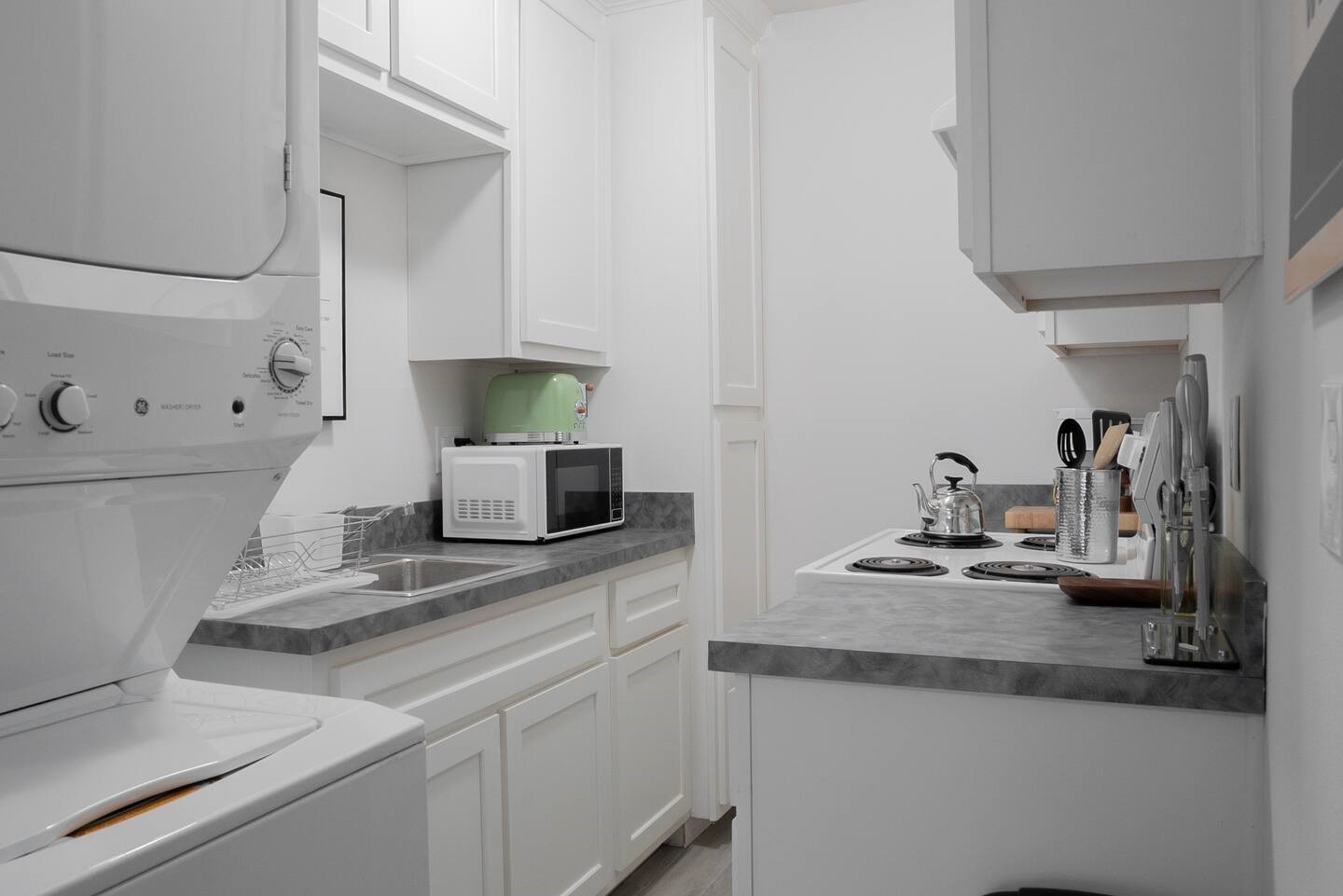 4903 Noble Street, Unit 1 Houston, TX 77020 - Photo 7 of 16 a kitchen with sink stove and wooden floor