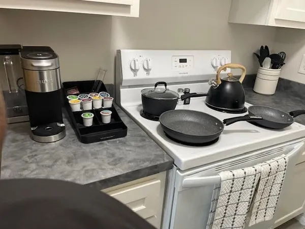 a kitchen with a stove and a refrigerator