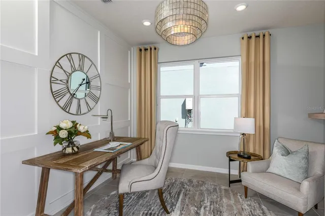 a living room with furniture a table and a window