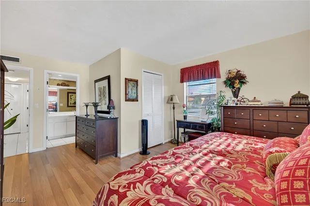 a bedroom with a bed and a dresser