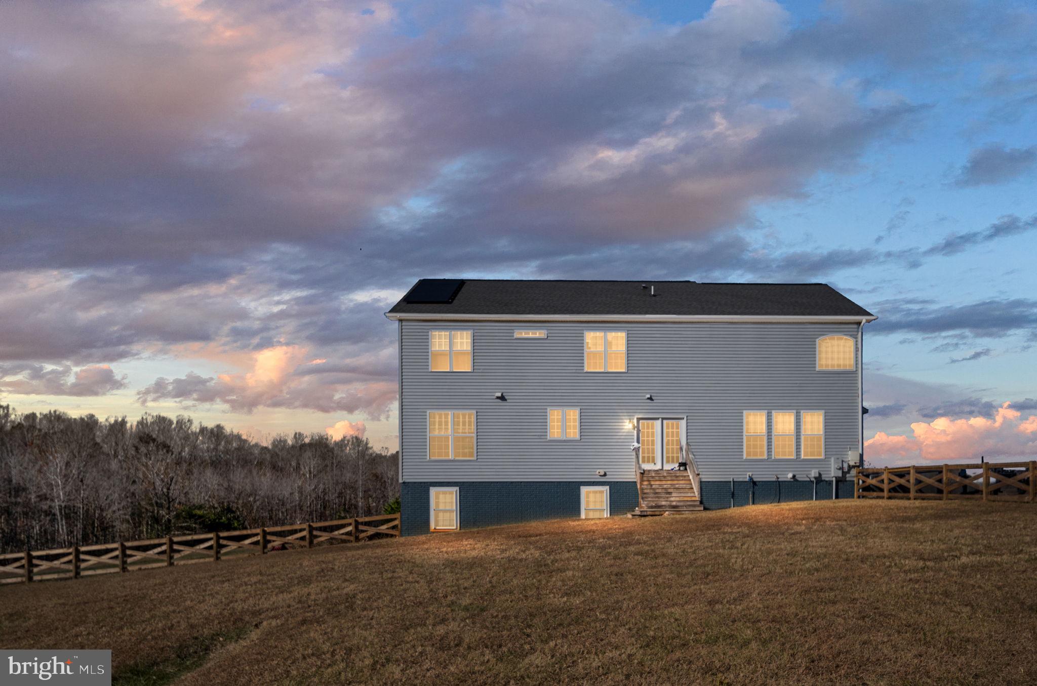 9590 Blackbird Loop Culpeper, VA 22701 - Photo 11 of 76 a front view of a house with a yard