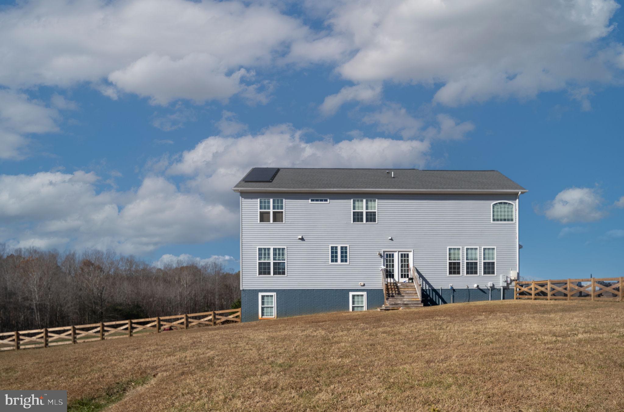 9590 Blackbird Loop Culpeper, VA 22701 - Photo 14 of 76 a view of a house with a yard