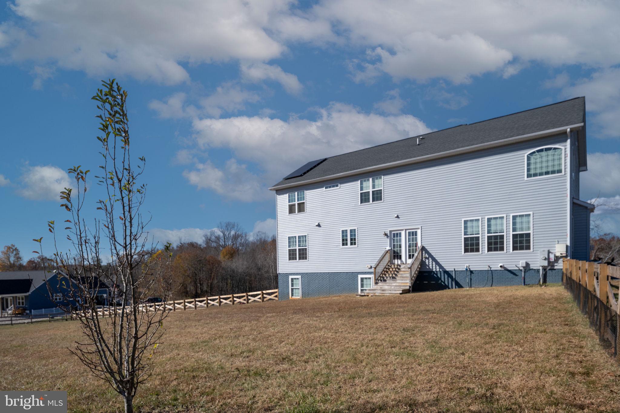 9590 Blackbird Loop Culpeper, VA 22701 - Photo 15 of 76 a view of a house with a yard