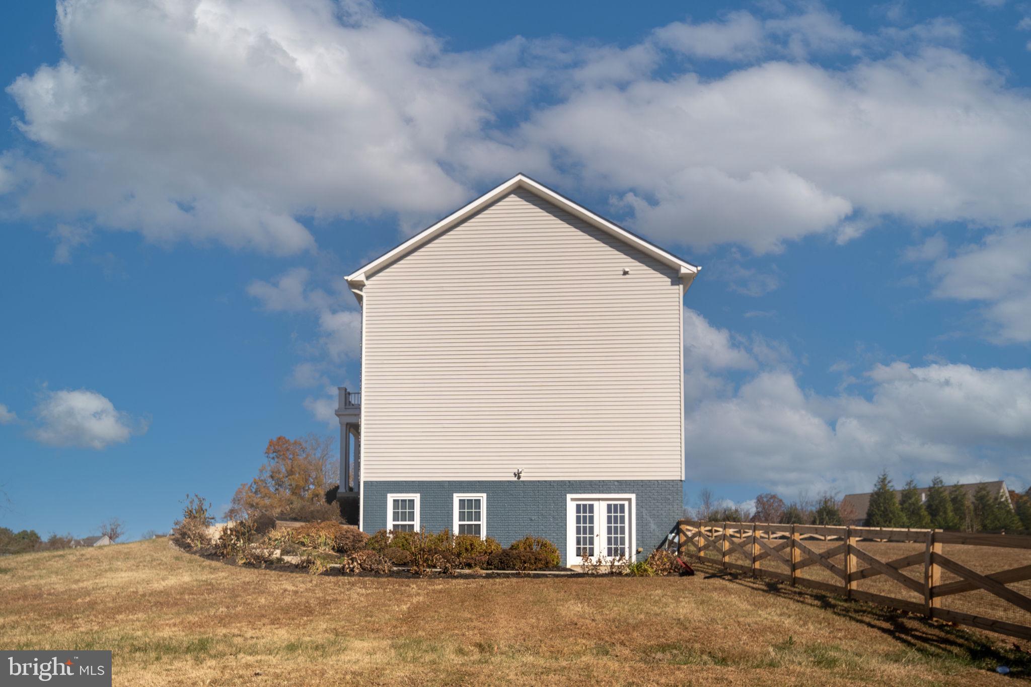 9590 Blackbird Loop Culpeper, VA 22701 - Photo 19 of 76 Side View of the property. Entrance to Lower level