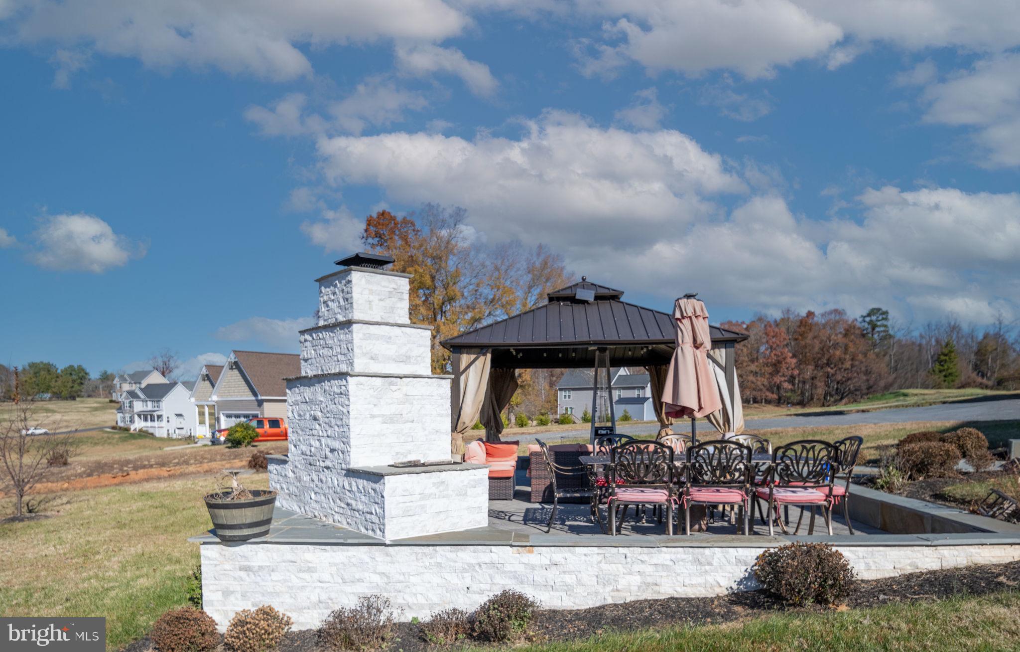 9590 Blackbird Loop Culpeper, VA 22701 - Photo 24 of 76 Outdoor Fireplace