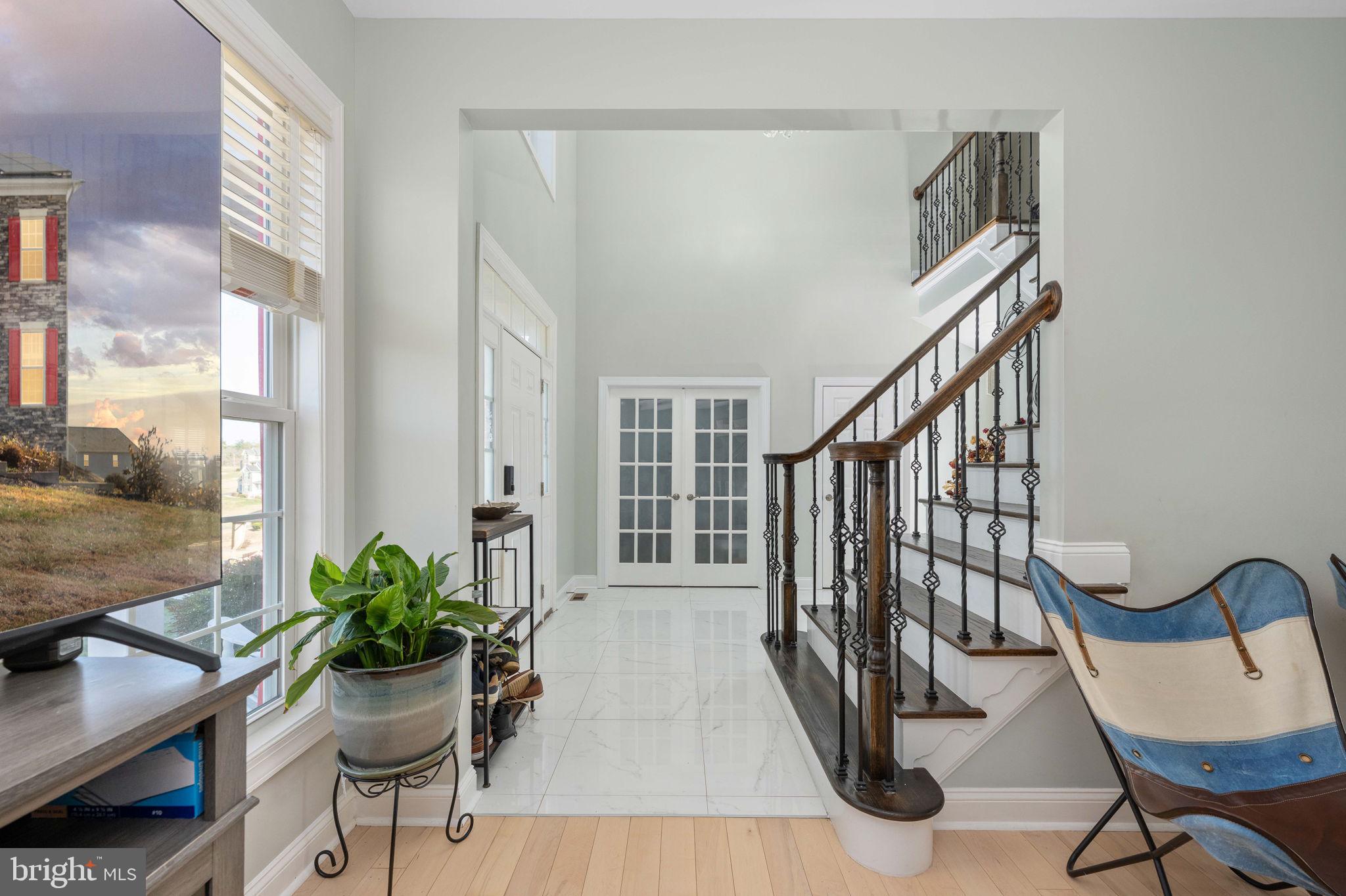 9590 Blackbird Loop Culpeper, VA 22701 - Photo 28 of 76 a view of a dining room with furniture window and wooden floor