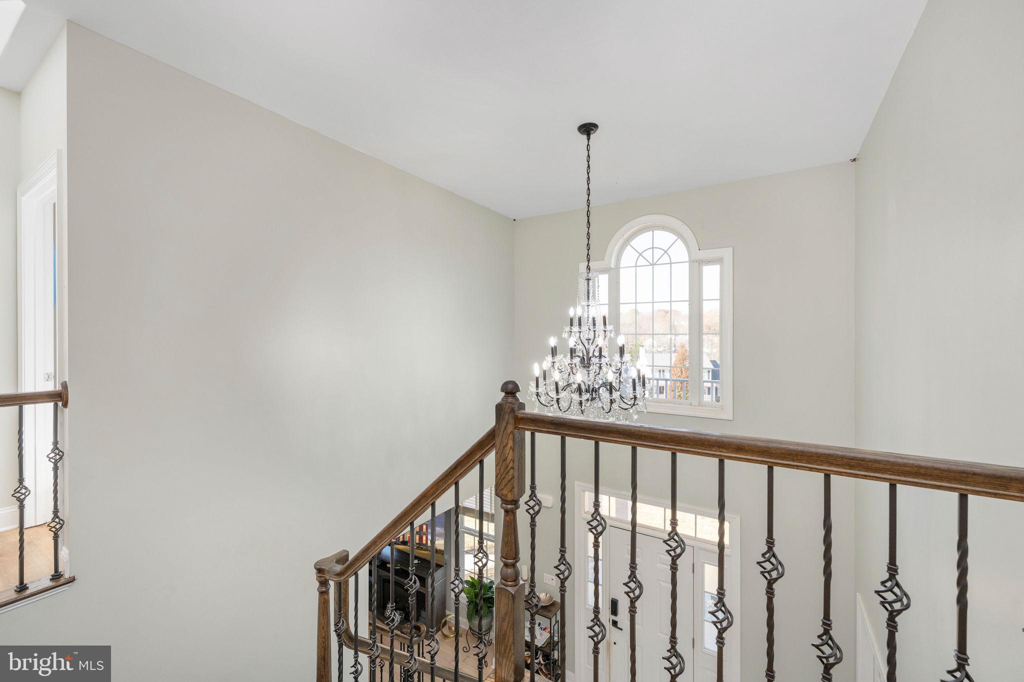 9590 Blackbird Loop Culpeper, VA 22701 - Photo 32 of 76 a view of a hallway view with a chandelier