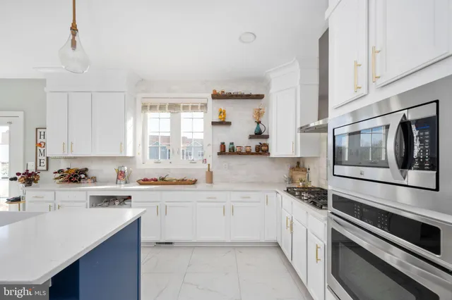 a bedroom with a bed and a chair