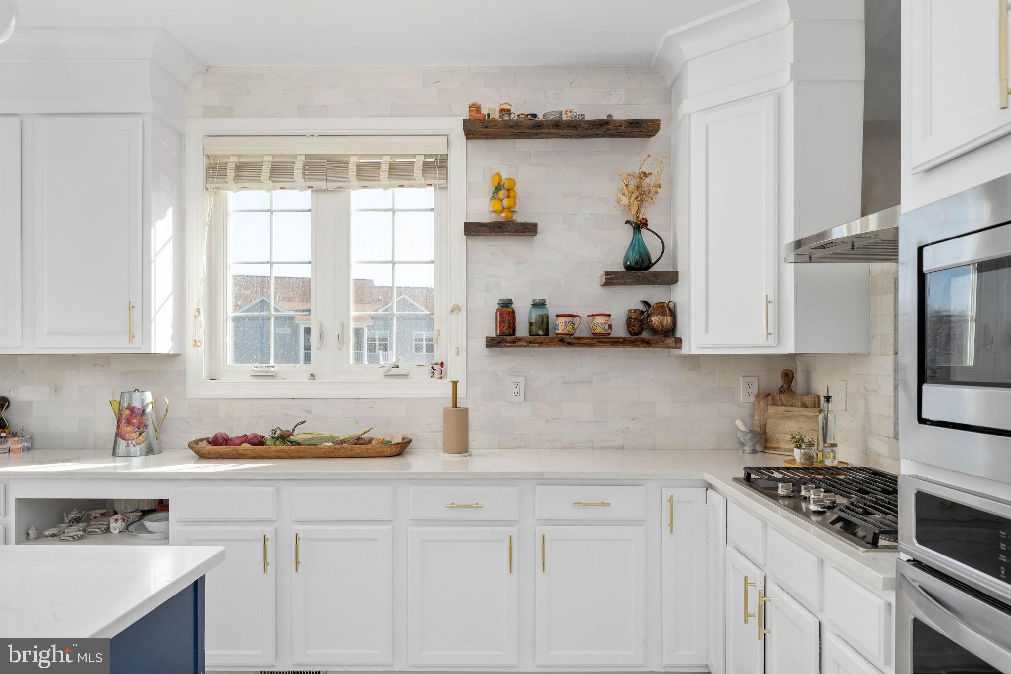 9590 Blackbird Loop Culpeper, VA 22701 - Photo 37 of 76 a kitchen with stainless steel appliances granite countertop a sink stove and cabinets