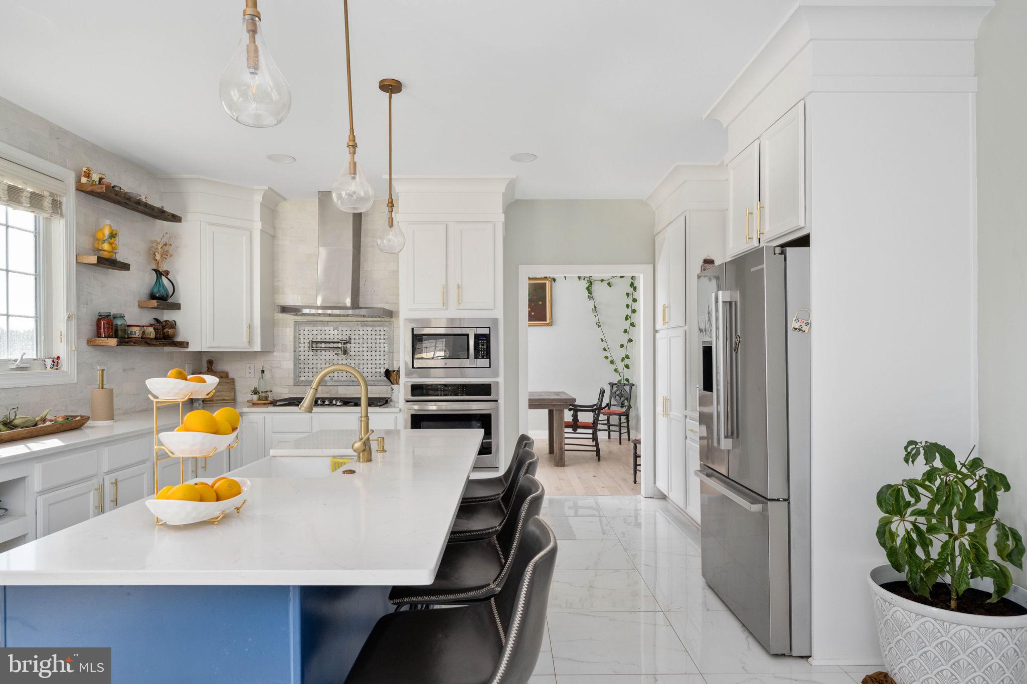 9590 Blackbird Loop Culpeper, VA 22701 - Photo 42 of 76 a view of kitchen with dining table and chairs