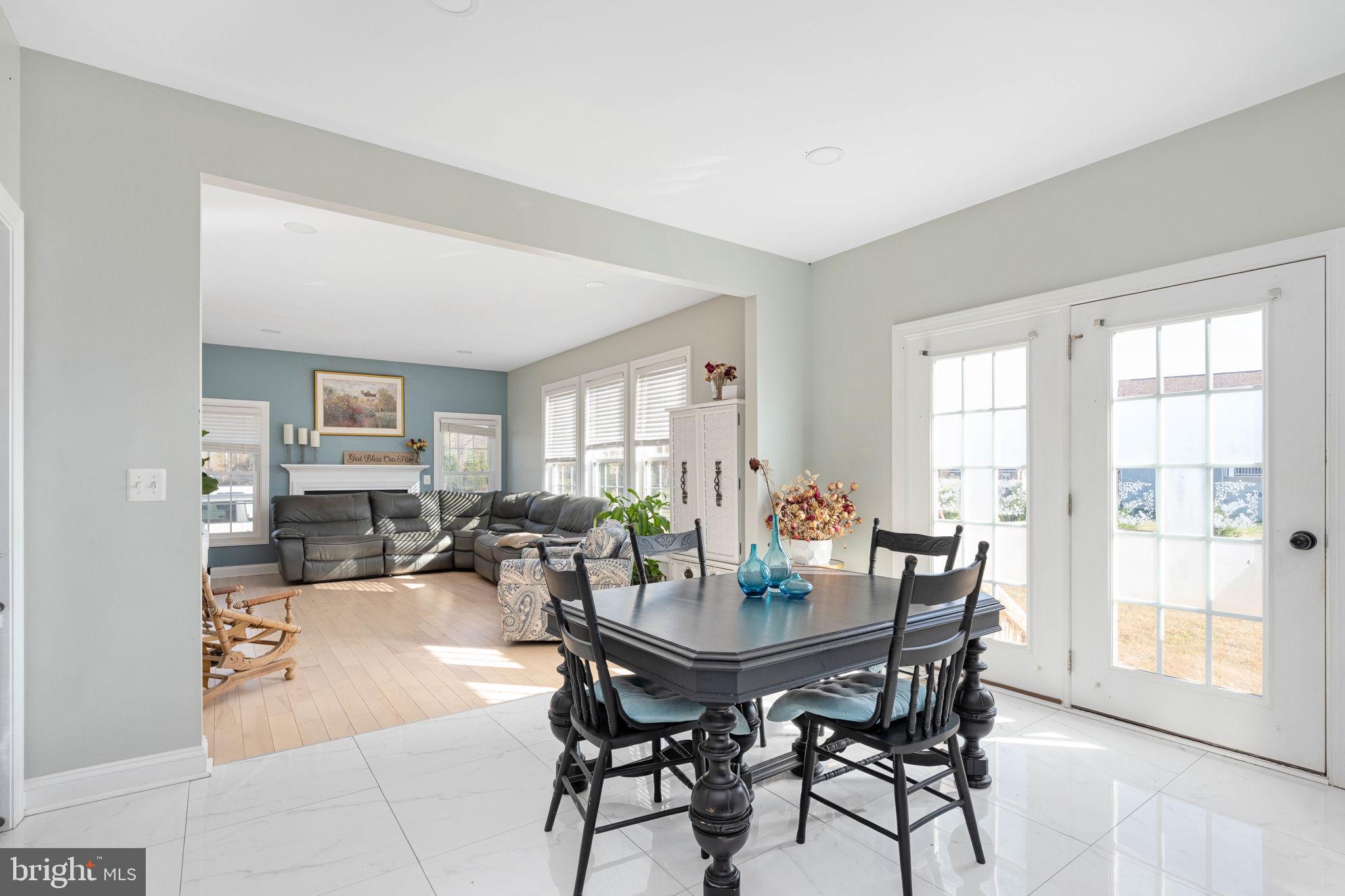9590 Blackbird Loop Culpeper, VA 22701 - Photo 45 of 76 a view of a dining room with furniture and wooden floor
