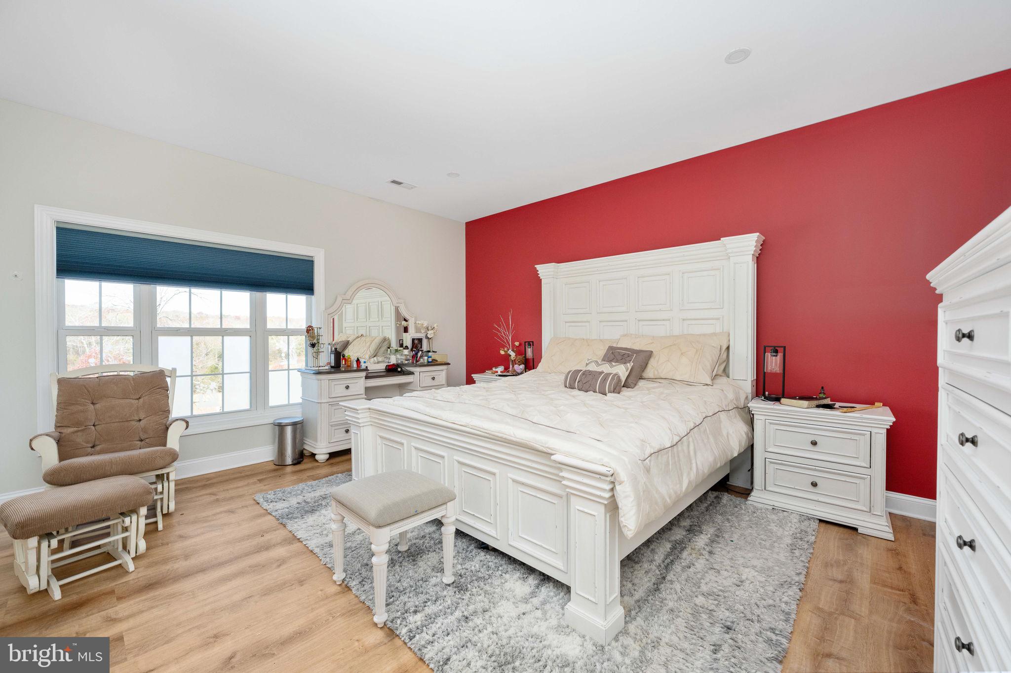 9590 Blackbird Loop Culpeper, VA 22701 - Photo 58 of 76 a bedroom with a bed and a chair