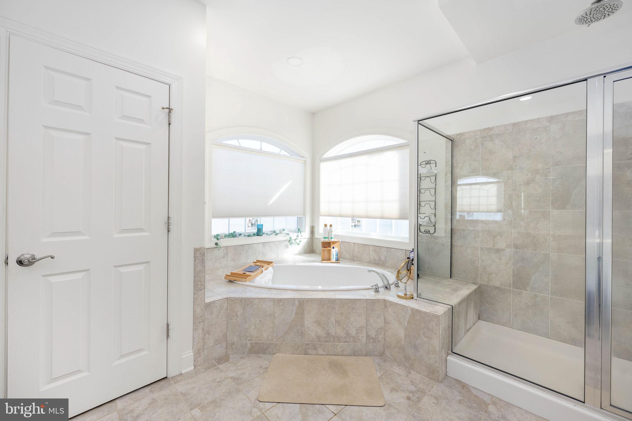 9590 Blackbird Loop Culpeper, VA 22701 - Photo 62 of 76 a spacious bathroom with a tub shower and sink