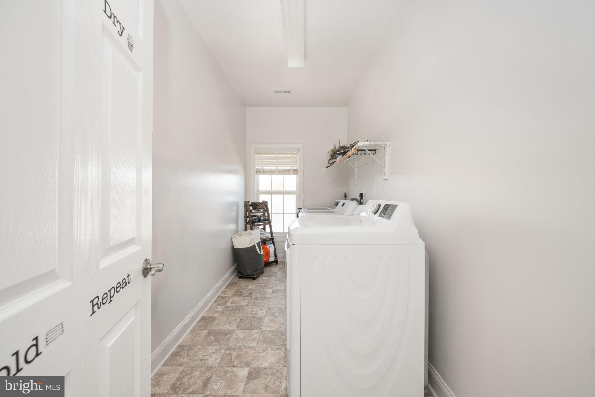 9590 Blackbird Loop Culpeper, VA 22701 - Photo 63 of 76 a utility room with dryer and washer