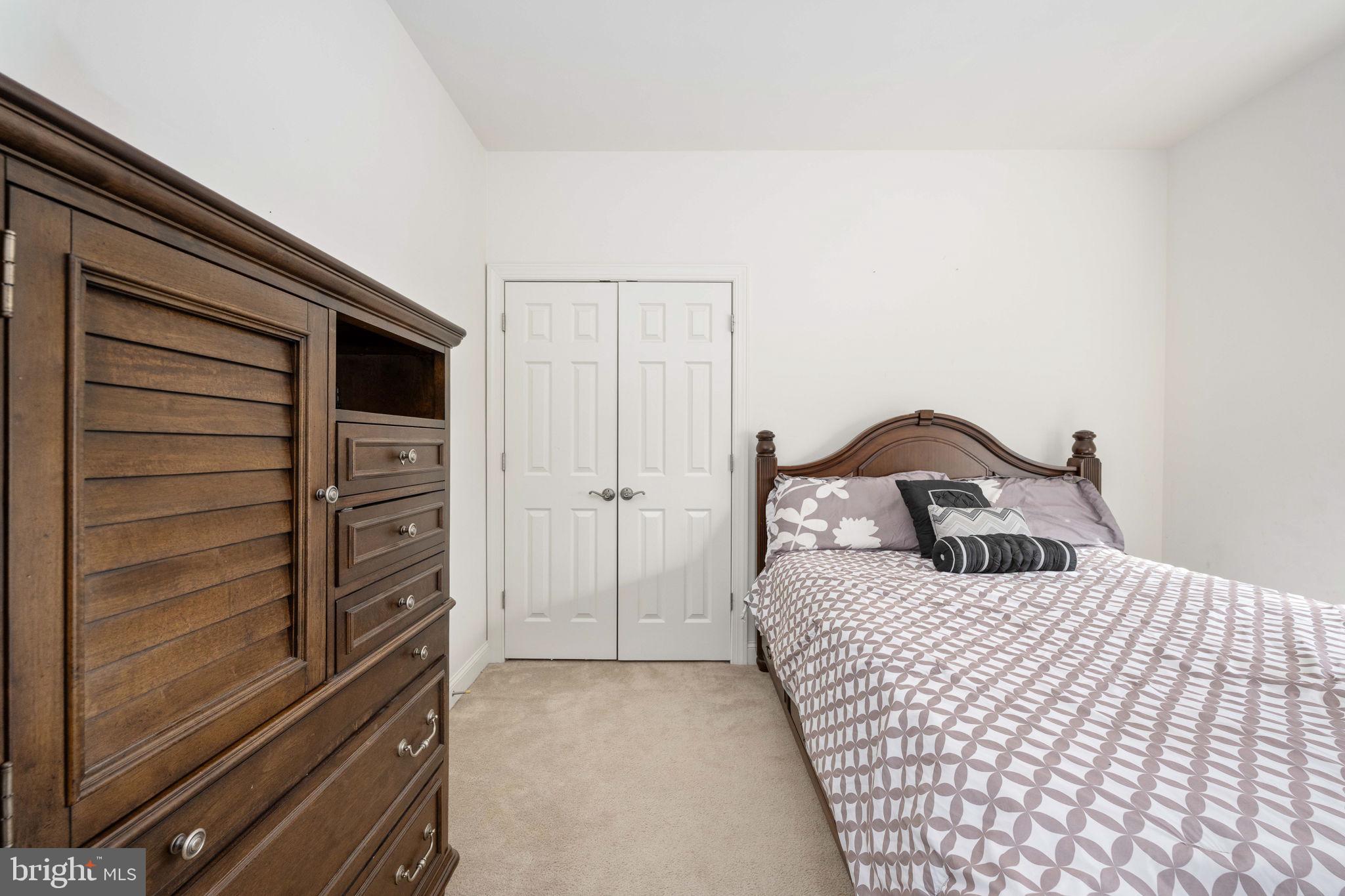 9590 Blackbird Loop Culpeper, VA 22701 - Photo 65 of 76 a bedroom with a bed and a dresser