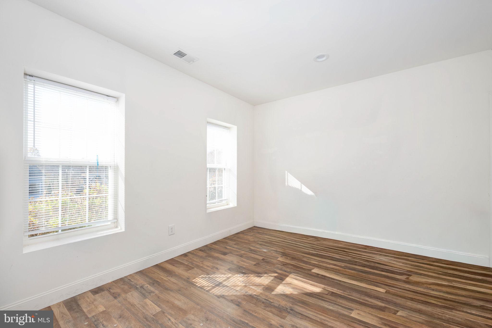 9590 Blackbird Loop Culpeper, VA 22701 - Photo 66 of 76 a view of empty room with wooden floor and fan