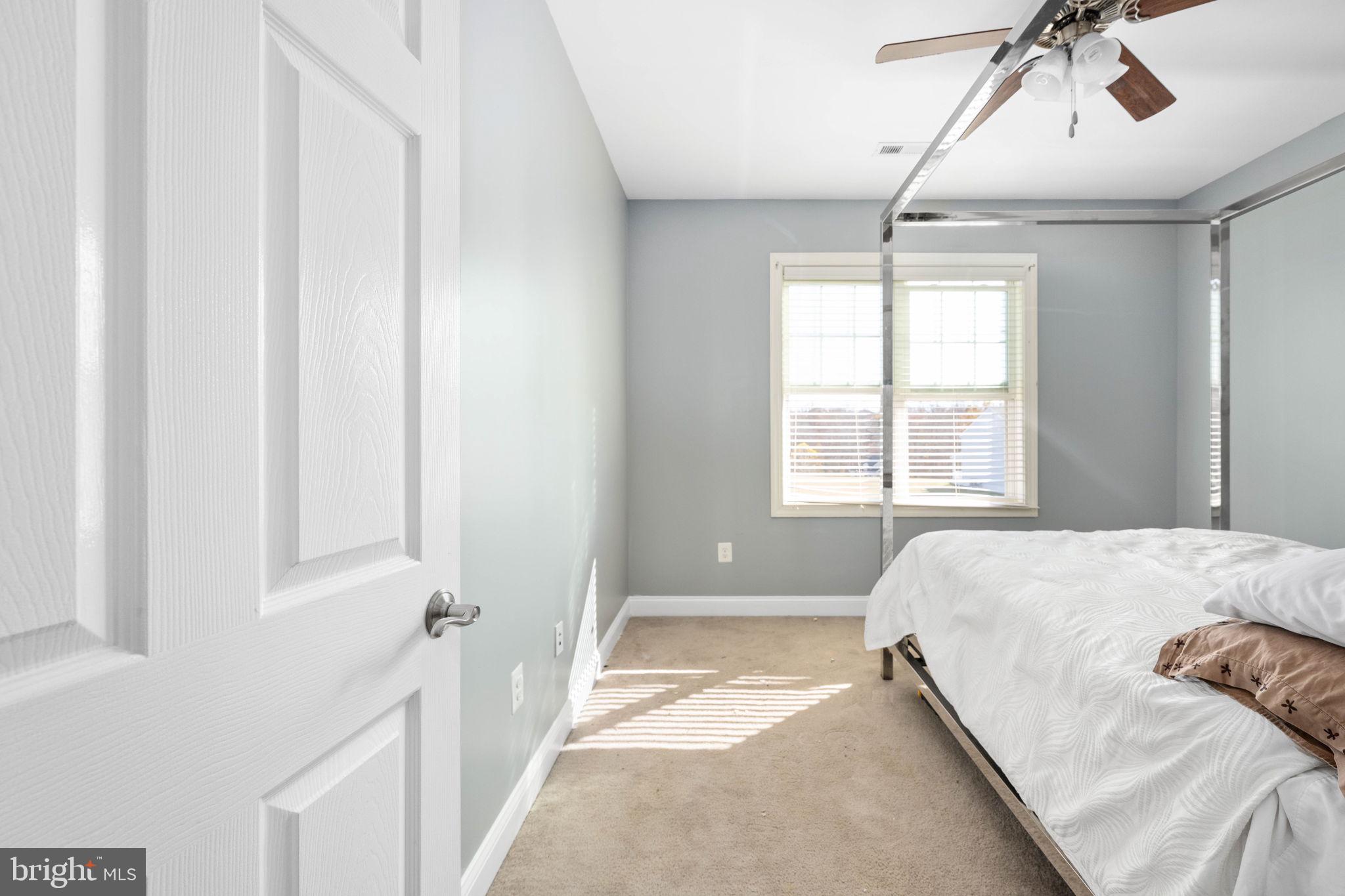 9590 Blackbird Loop Culpeper, VA 22701 - Photo 68 of 76 a bedroom with a bed and a window