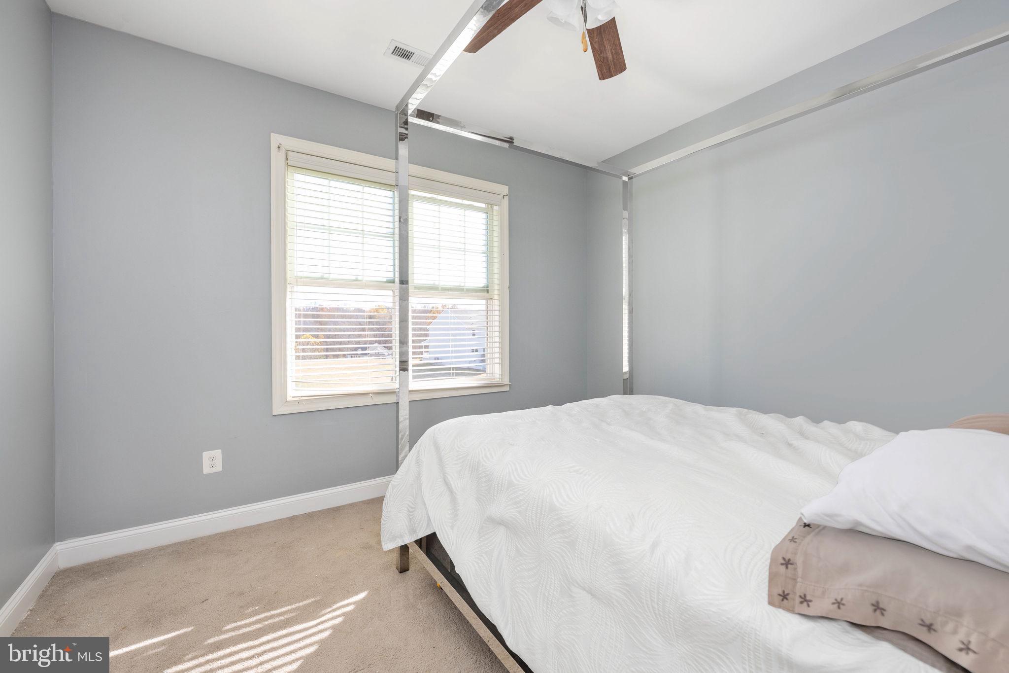 9590 Blackbird Loop Culpeper, VA 22701 - Photo 69 of 76 a bedroom with a bed and a window