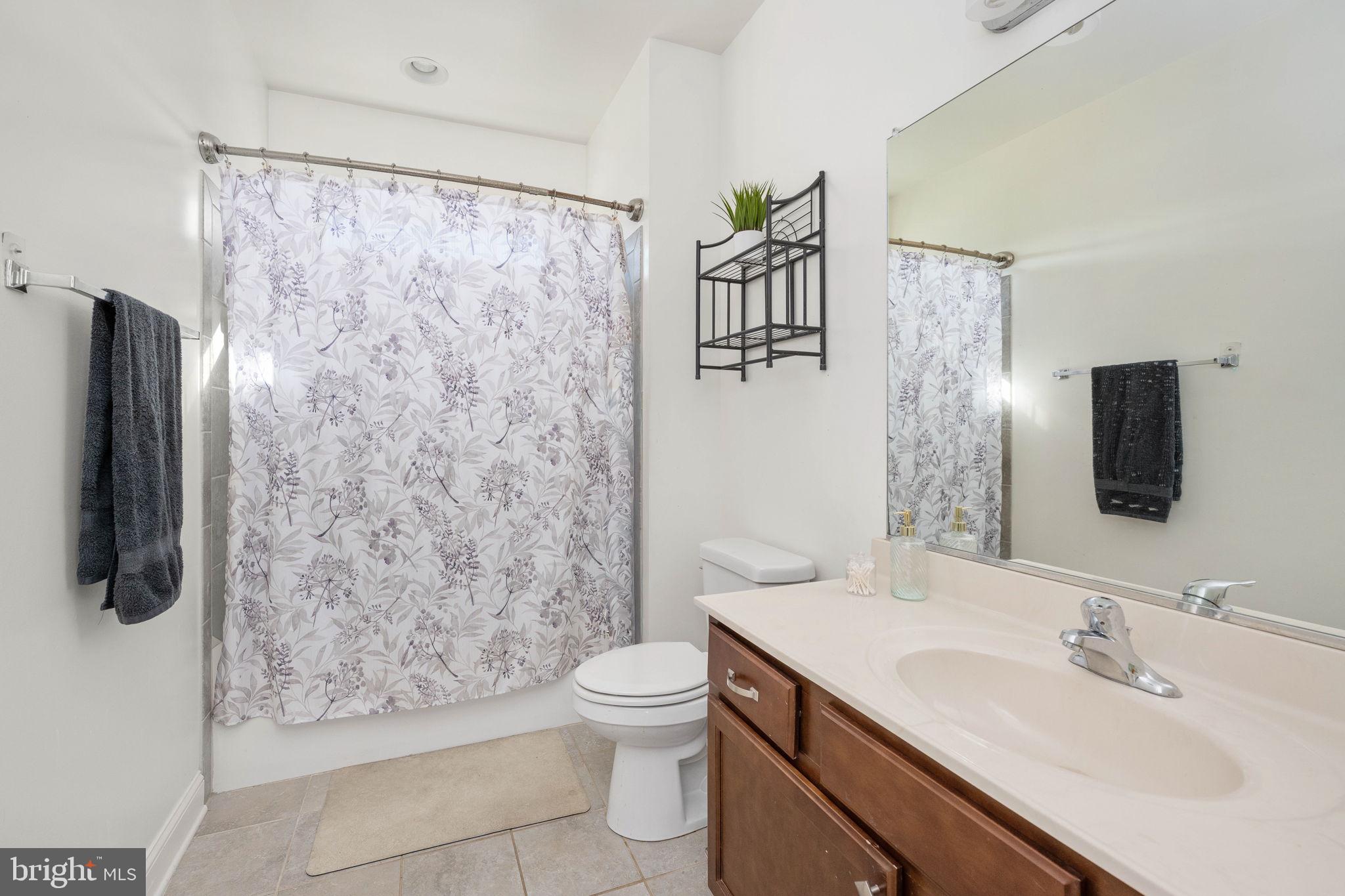 9590 Blackbird Loop Culpeper, VA 22701 - Photo 72 of 76 a bathroom with a sink toilet and shower