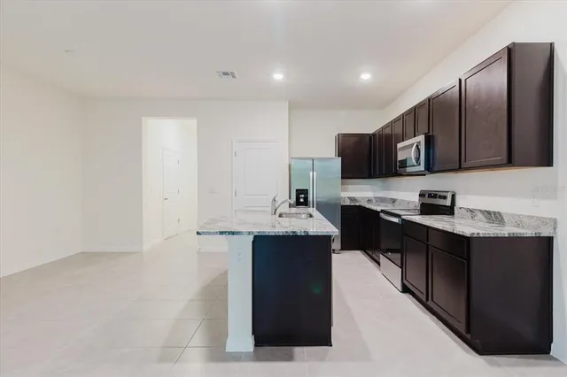 a kitchen with granite countertop a sink and granite countertops