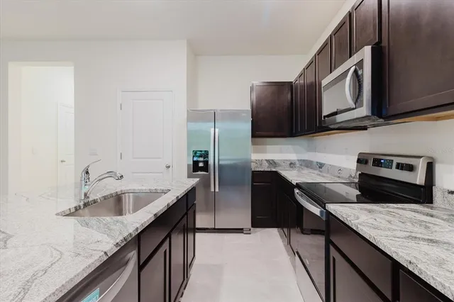 an empty room with floor to ceiling windows