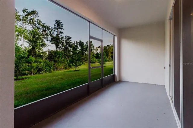 a view of an empty room with an entryway