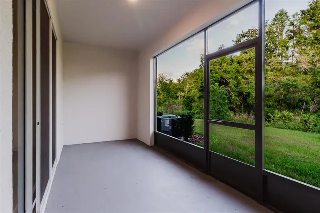 a bathroom with a granite countertop sink a toilet a mirror and shower