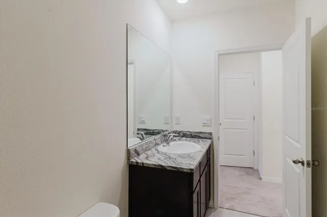 a view of a house with backyard and porch