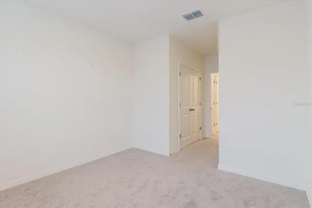 an aerial view of a house with garden space and street view