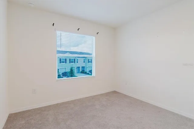 an aerial view of a house with a garden