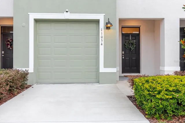 a bathroom with a granite countertop toilet and a shower