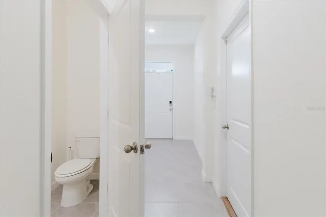 a view living room with stainless steel appliances kitchen island sink and refrigerator