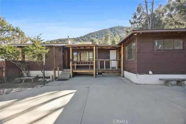 a view of outdoor space with wooden floor and city view