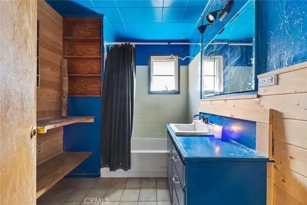 a bedroom with bed and a window