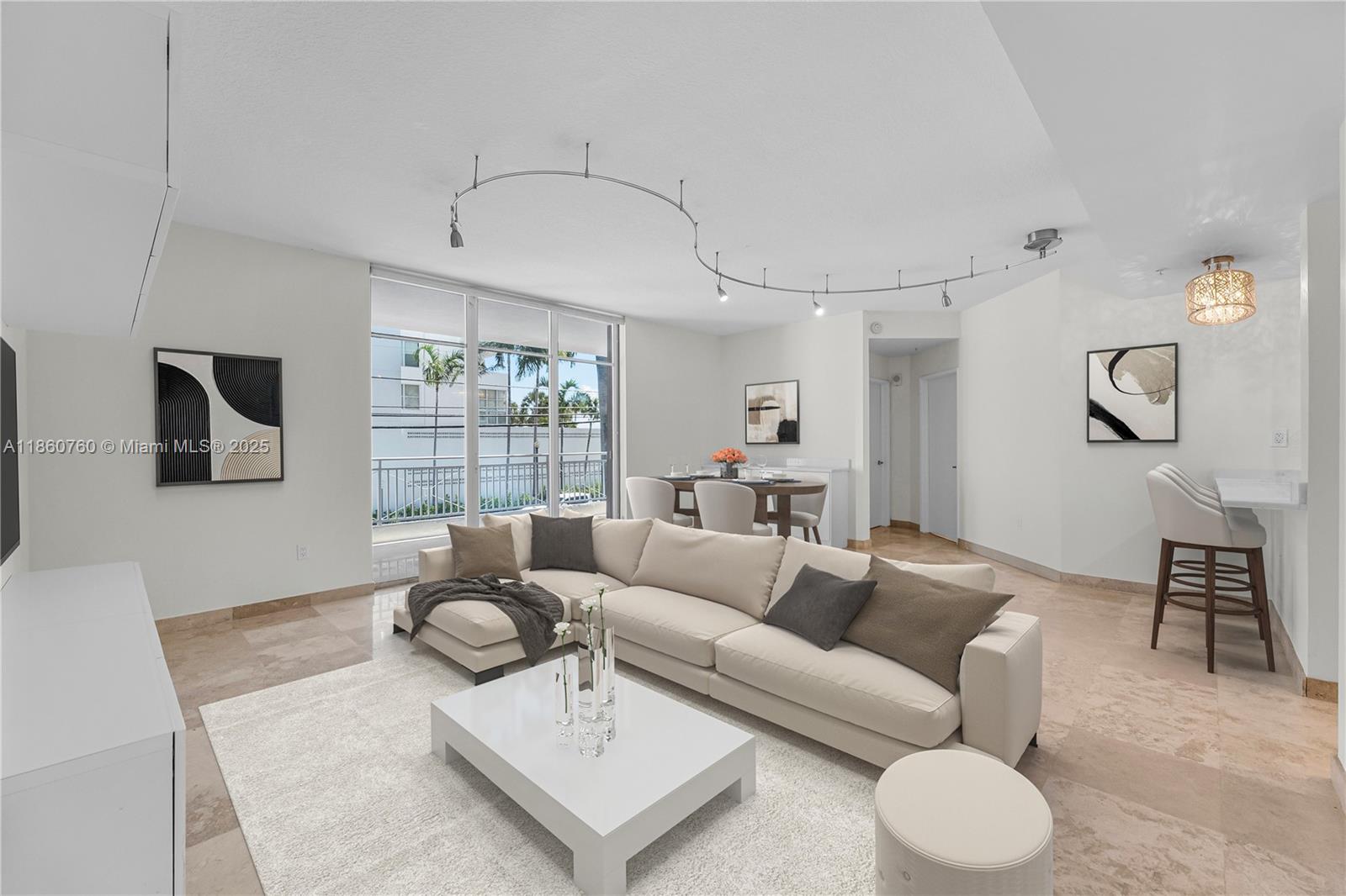 1 Century Lane, Unit 202 Miami Beach, FL 33139 - Photo 2 of 28 a living room with furniture and a large window