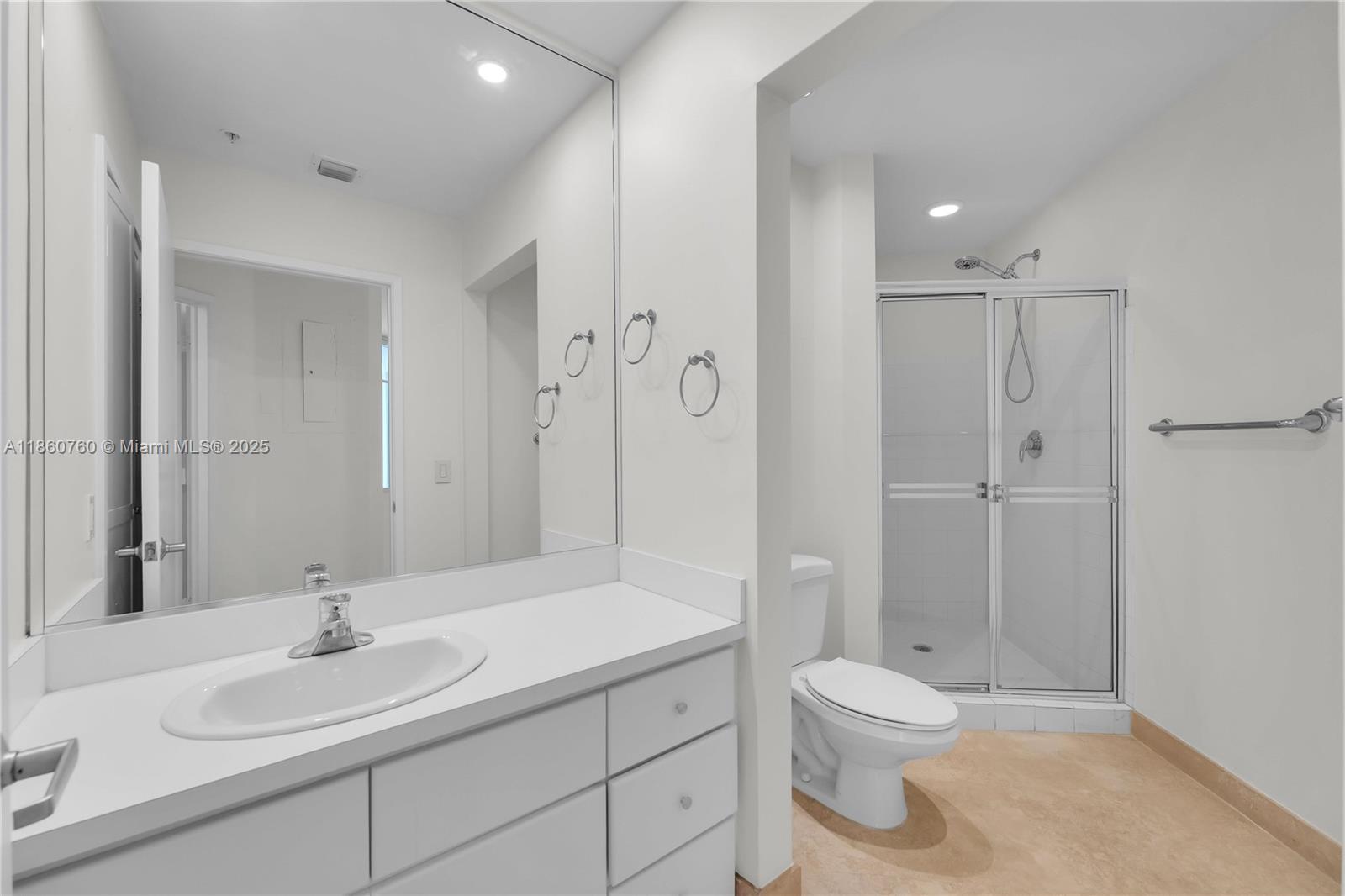 1 Century Lane, Unit 202 Miami Beach, FL 33139 - Photo 22 of 28 a bathroom with a sink a toilet and shower